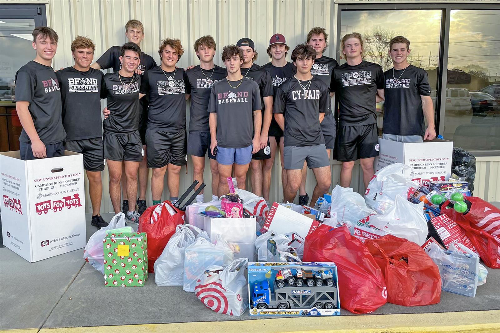 Members of the Cy-Fair High School baseball team pose with donations they collected for Toys for Tots.